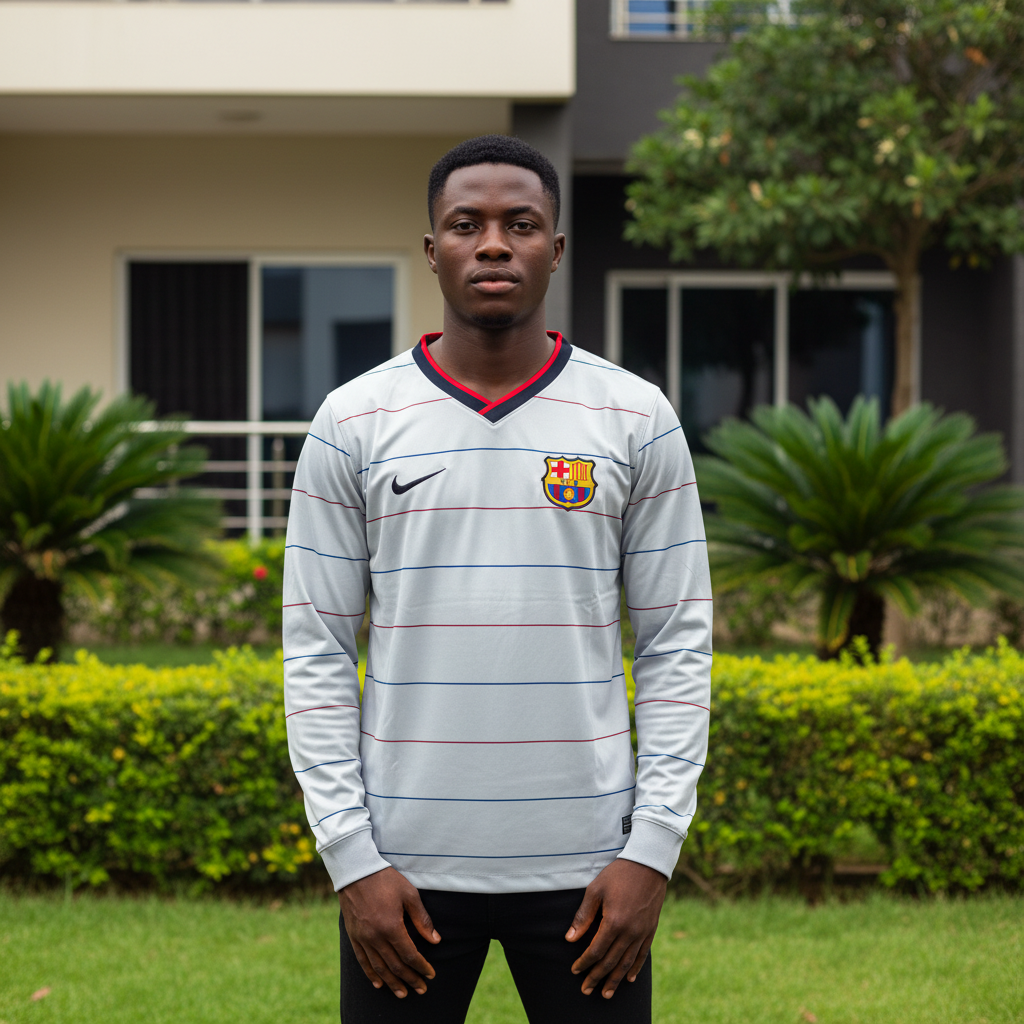 Grey and navy pinstripe long-sleeve retro football jersey — Nigerian male model front view