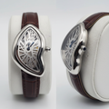 Asymmetric silver skeleton dial watch with dark brown strap front and side view