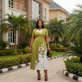 Women's olive green botanical print lace collar pleated midi gown – Nigerian model lifestyle shot