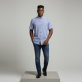 Nigerian male model wearing blue and white striped short-sleeved shirt