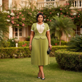 Women's chartreuse green peplum pleated midi gown – Nigerian model lifestyle shot