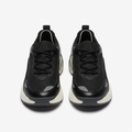Front view of black mesh sneaker pair with cream-white chunky soles