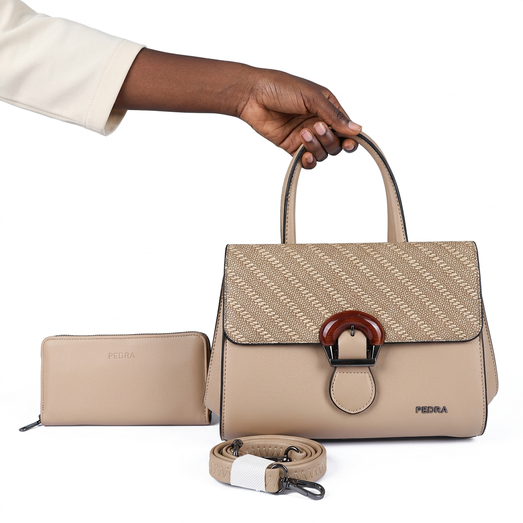 Black adult woman’s hand holding a beige patterned-flap handbag set on white