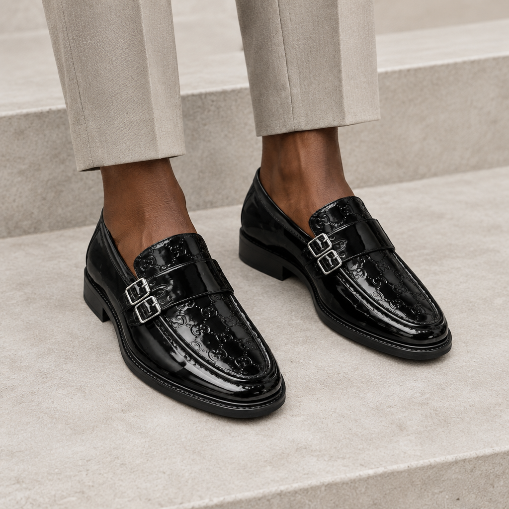 Black model wearing black men's embossed double-buckle loafers