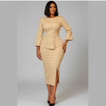 Black Nigerian model wearing the cream peplum skirt suit with gold buttons