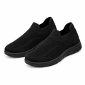 Pair of all-black knit slip-on sneakers on white