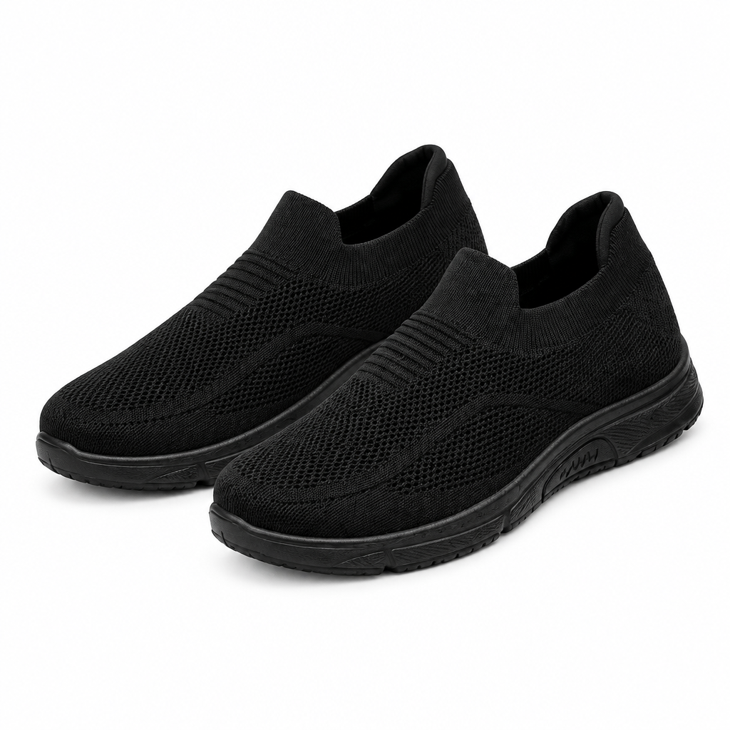 Pair of all-black knit slip-on sneakers on white