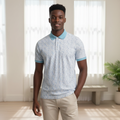Young Nigerian male model wearing white floral print polo shirt with blue contrast collar