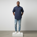 Nigerian male model wearing navy blue short-sleeved shirt