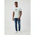 Young Nigerian male wearing sage green Café Italia Kappa 67 graphic crew neck tee