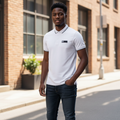 Young Nigerian male model wearing white polo with black badge and tipping
