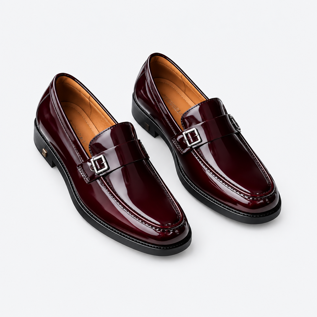 Oxblood men's double-buckle loafers shown as a complete pair