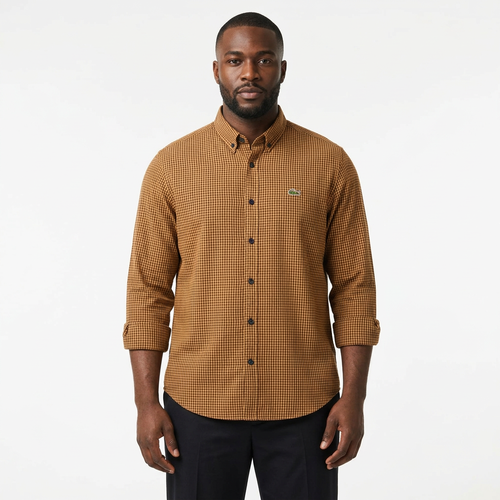 Adult Black model wearing a brown micro-check shirt with sleeves rolled up