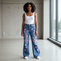 Nigerian female model wearing pink blossom ripped flare jeans front view