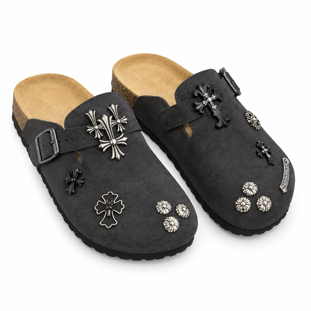 Pair of charcoal cross-charm buckle clogs on white background