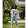 Nigerian female model wearing Women's White Oversized Cartoon Graphic Tee