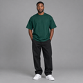 Man wearing plain dark green crew-neck T-shirt