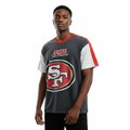 Young Nigerian male wearing dark charcoal SF 49ers recovered graphic tee