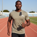 Black Nigerian male model wearing taupe premium sport jersey on running track