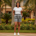 Nigerian female model wearing grey washed denim shorts - front view