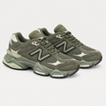 Pair of olive-gray mesh running sneakers with chunky soles and light accents