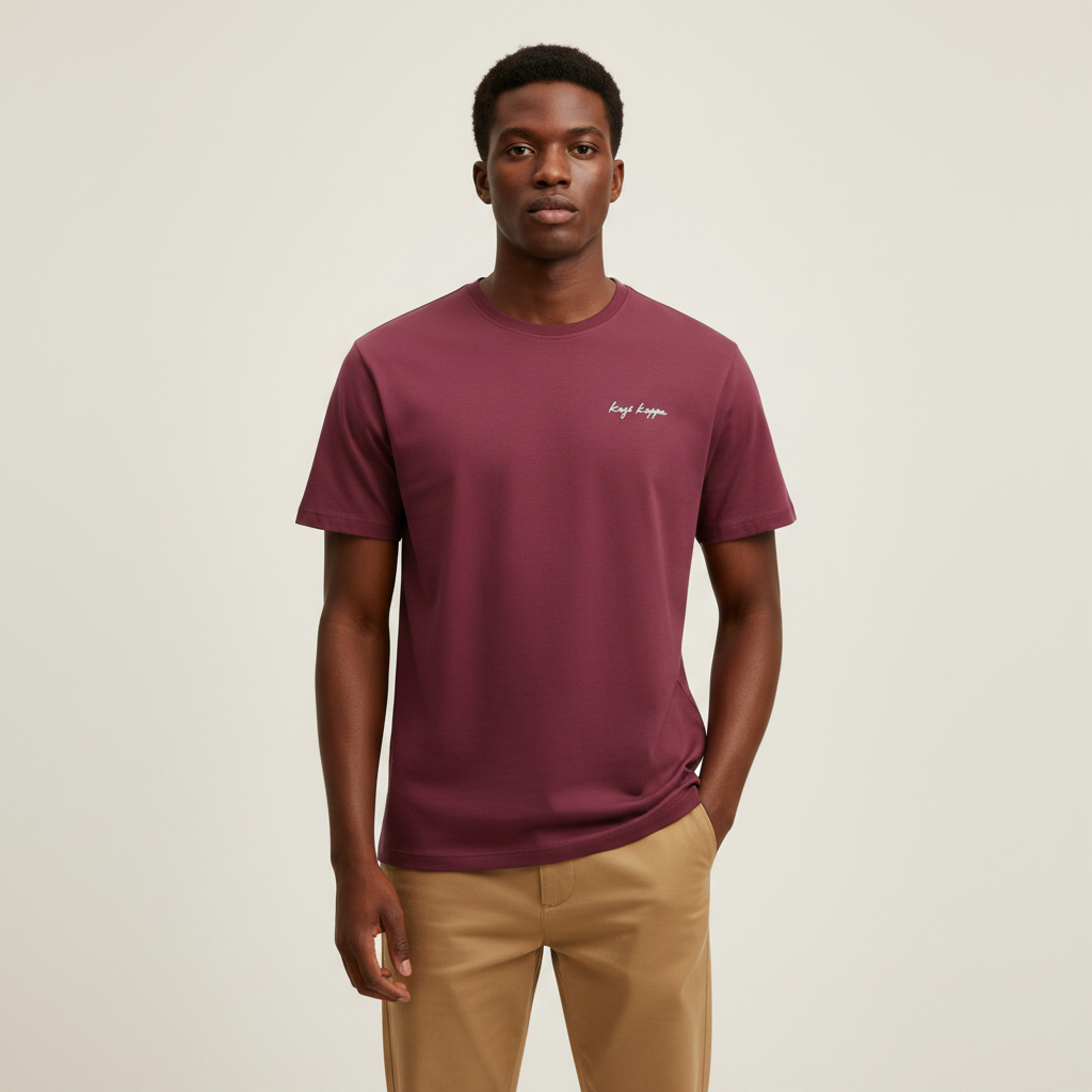 Young Nigerian male wearing burgundy mosaic back graphic crew neck tee
