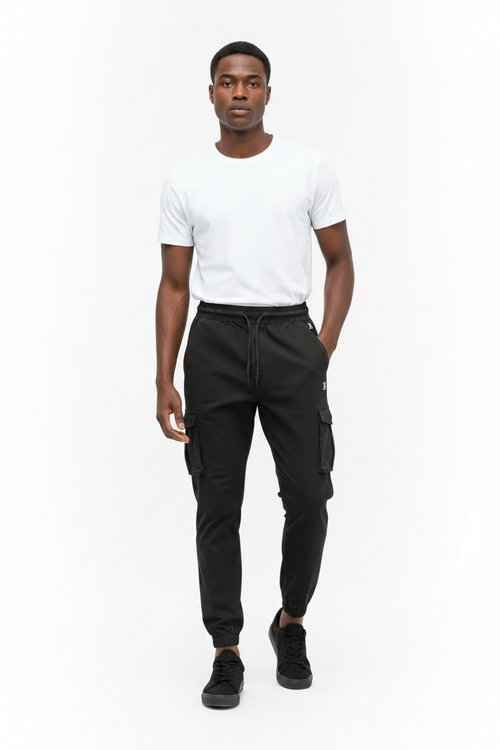 African male model wearing black cargo jogger pants with white t-shirt