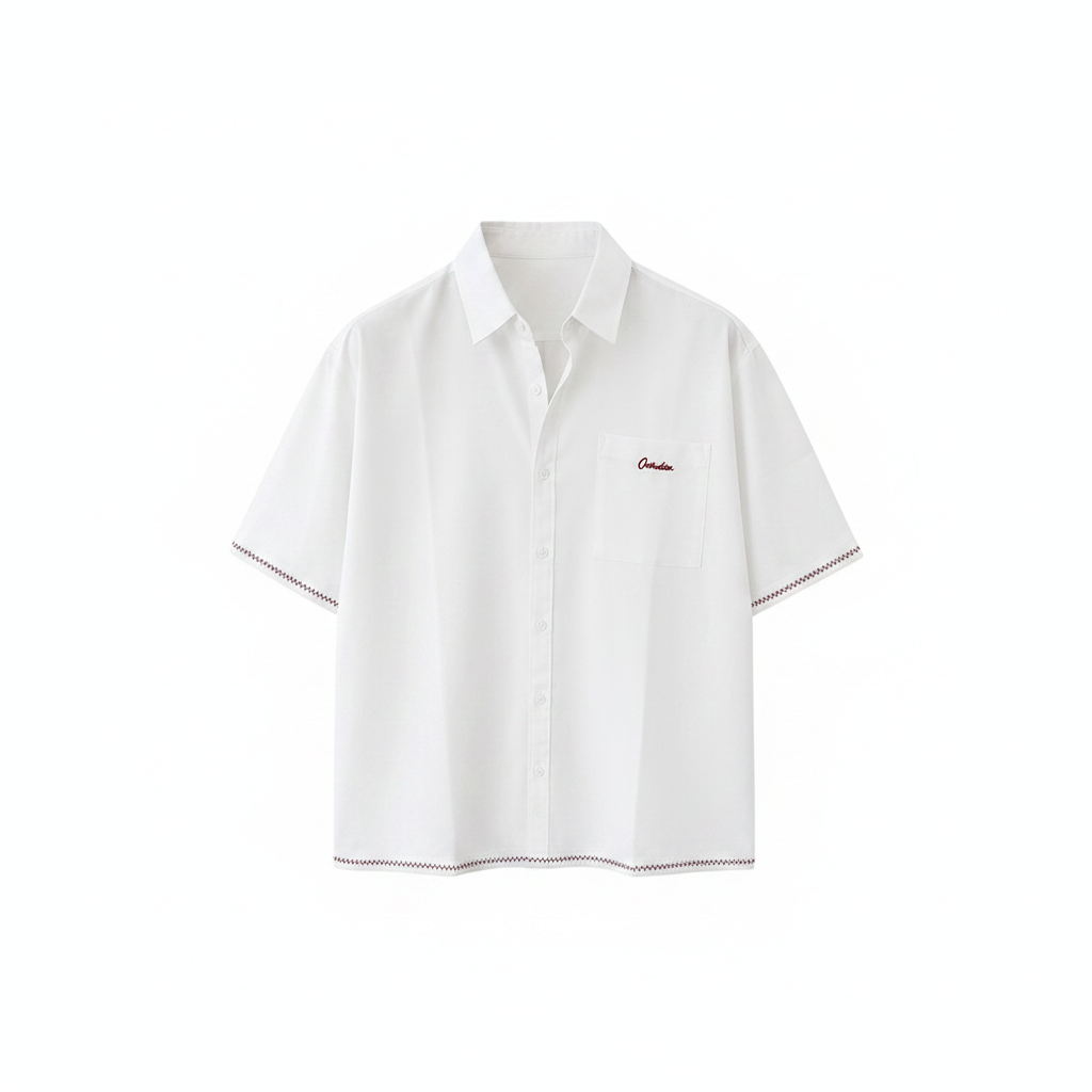 Men's white boxy short-sleeve shirt with dark red script embroidery and black zigzag trim, ghost mannequin front view