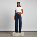 Nigerian female model wearing navy CK wide-leg high-rise jeans