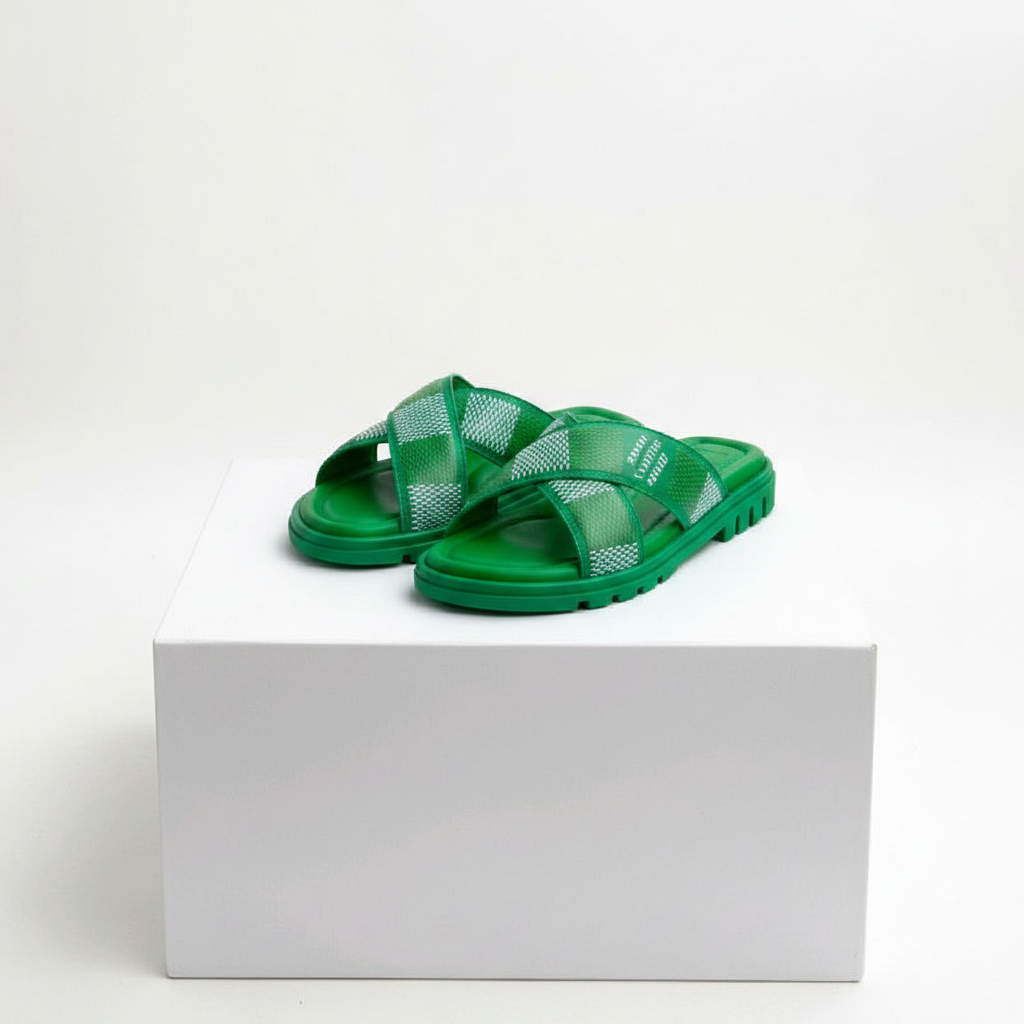 Men's green embossed cross-strap slide sandals pair on white platform