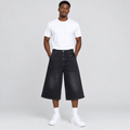 Model wearing black denim long shorts