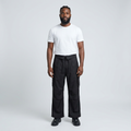 Full-body male model wearing black wide-leg cargo trousers