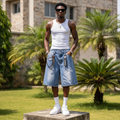 Nigerian male model wearing men's light blue cursive script rhinestone stud denim shorts streetwear style
