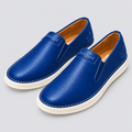 Pair of royal blue slip-on shoes with off-white soles