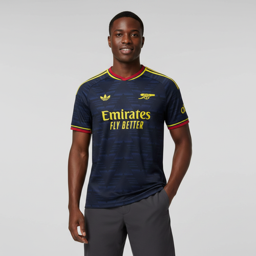 Nigerian male model wearing Arsenal third dark navy jersey