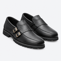 Black men's double-buckle brogue loafers shown as a complete pair