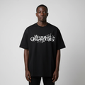 Model wearing black floral script graphic tee