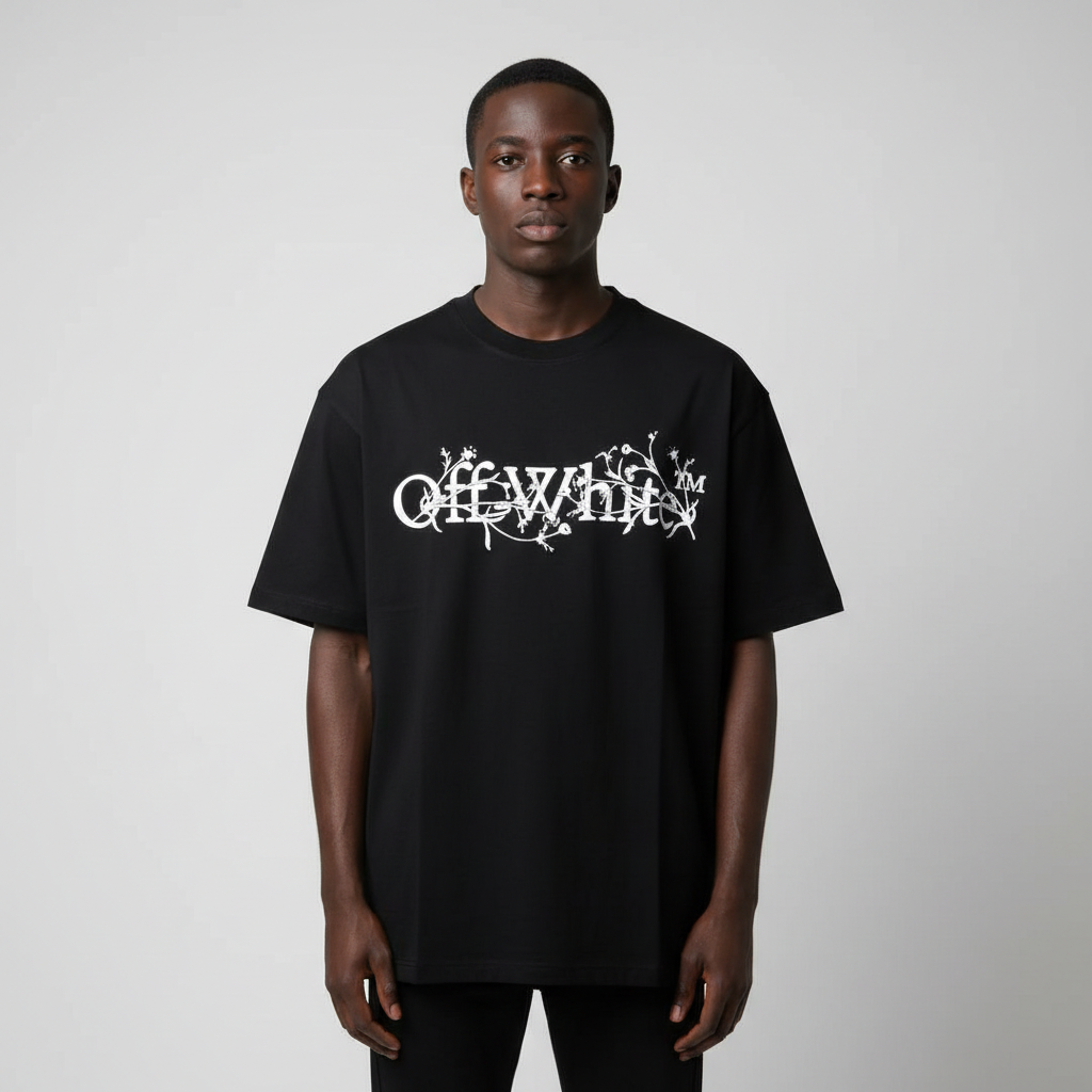 Model wearing black floral script graphic tee