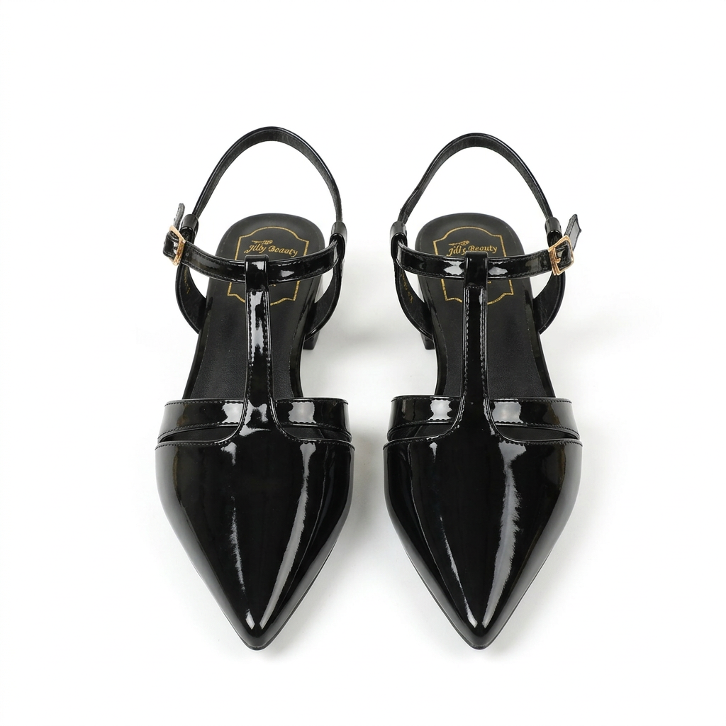 Black glossy pointed-toe T-strap low-heel shoe pair