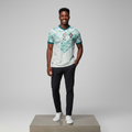 Nigerian male model wearing mint Portugal FPF away football jersey on concrete plinth