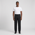 Full-body male model wearing black pleated panelled trousers