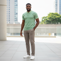 Young Nigerian male model wearing sage green checkerboard polo shirt
