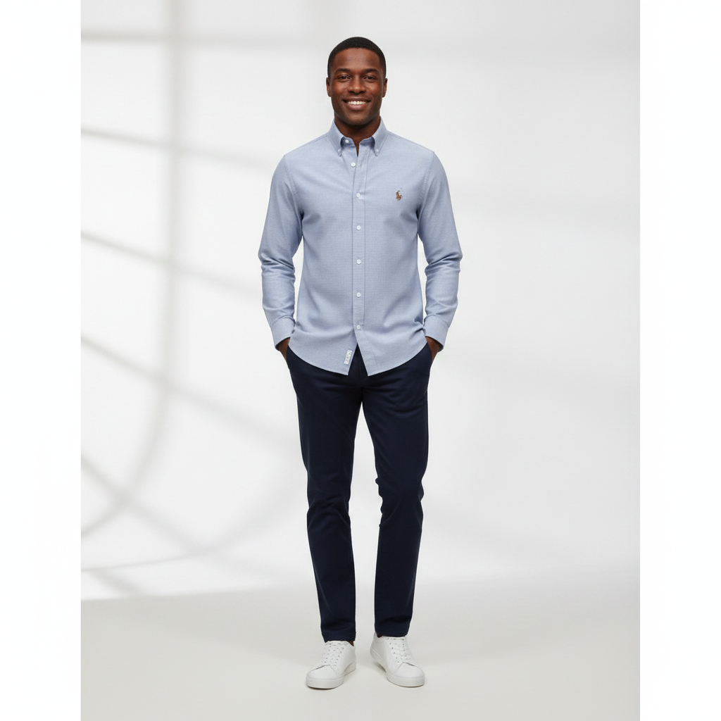 Nigerian adult male model wearing Light Blue Oxford Long Sleeve Shirt – Front View