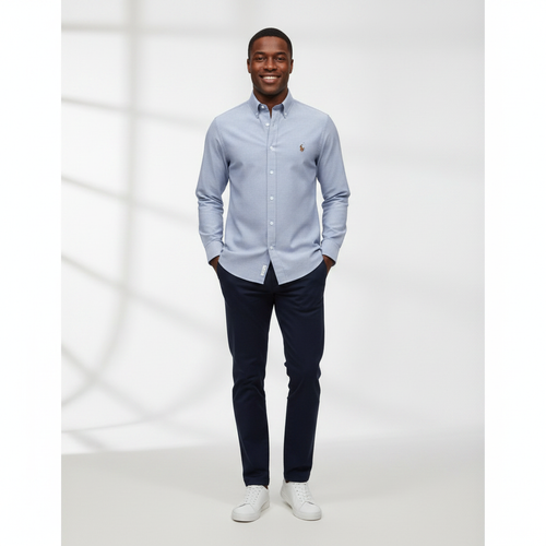 Nigerian adult male model wearing Light Blue Oxford Long Sleeve Shirt - Front View