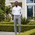 Nigerian male model wearing grey plaid trousers in outdoor setting