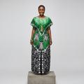 Nigerian female model wearing Green Adire Long Bubu Gown with smocked waist and gold tassel