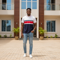 Young Nigerian male model wearing white red navy colour block polo shirt