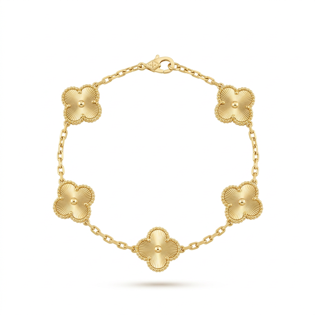 Gold engraved clover bracelet on white