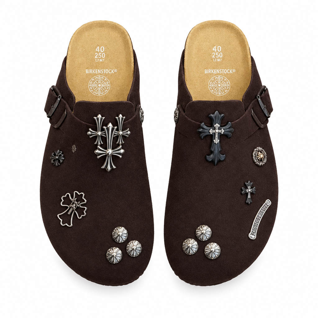 Chocolate cross-charm clog pair on white