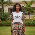 Nigerian female model wearing white muscle tank and African print maxi skirt set - front view corrected